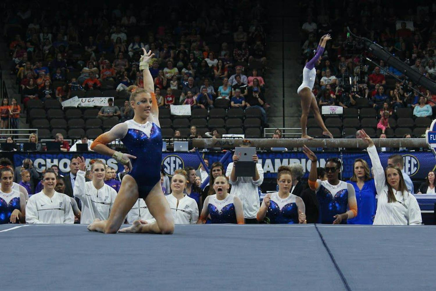 Florida's Alex McMurtry performs her floor routine in front of teammates during the SEC Gymnastics Championships on Saturday in Jacksonville, Florida.
