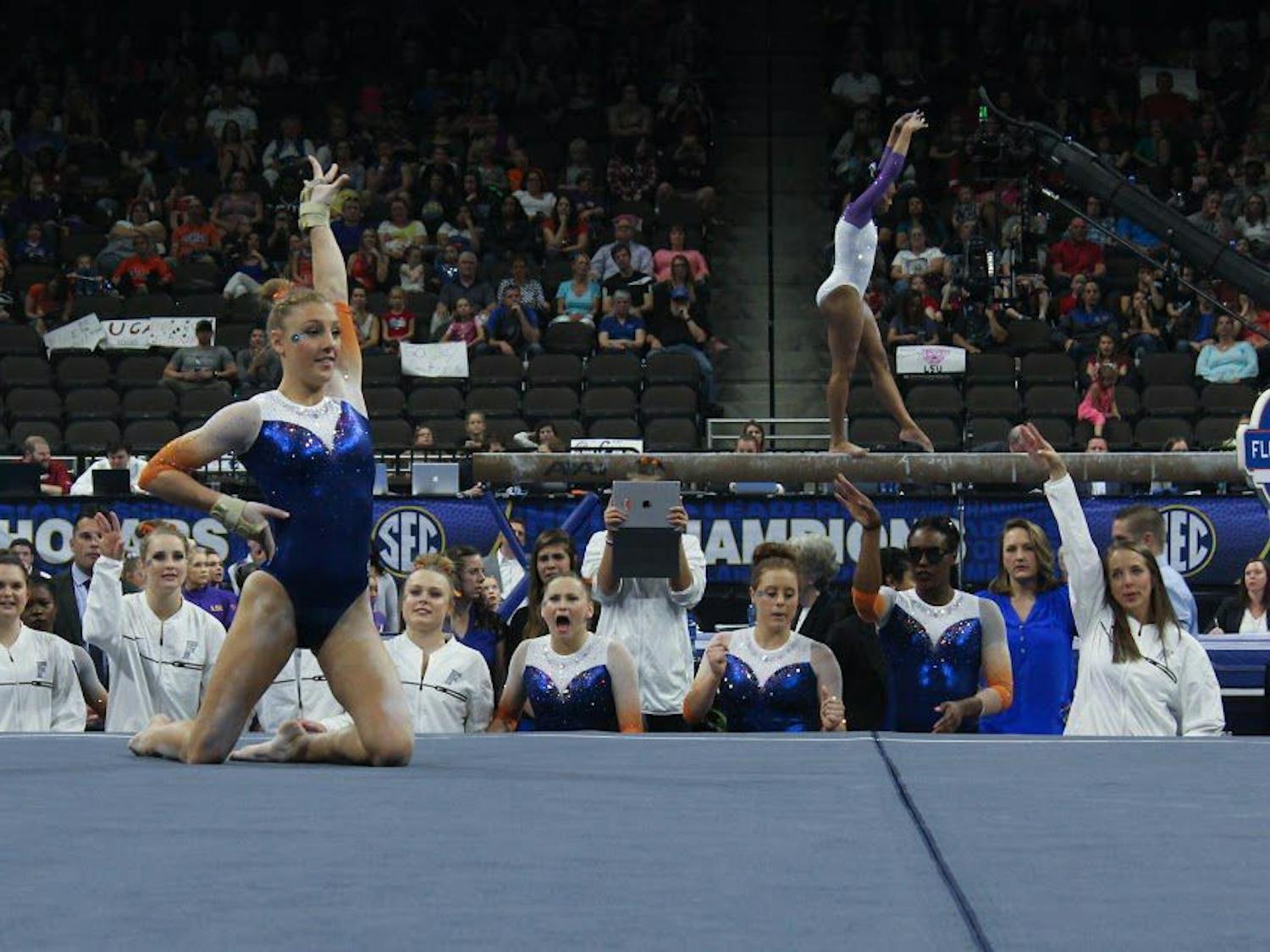 Florida's Alex McMurtry performs her floor routine in front of teammates during the SEC Gymnastics Championships on Saturday in Jacksonville, Florida.