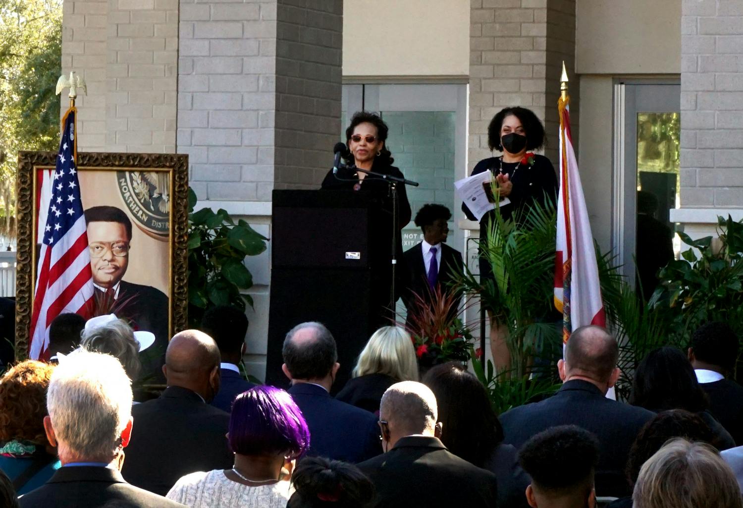 Judge Stephan Mickle's wife, Evelyn Mickle, speaks at the podium about her husband's trailblazing legacy at the renaming ceremony of the Alachua County Courthouse on Friday, Jan. 14. The courthouse is located at 220 S. Main St. 