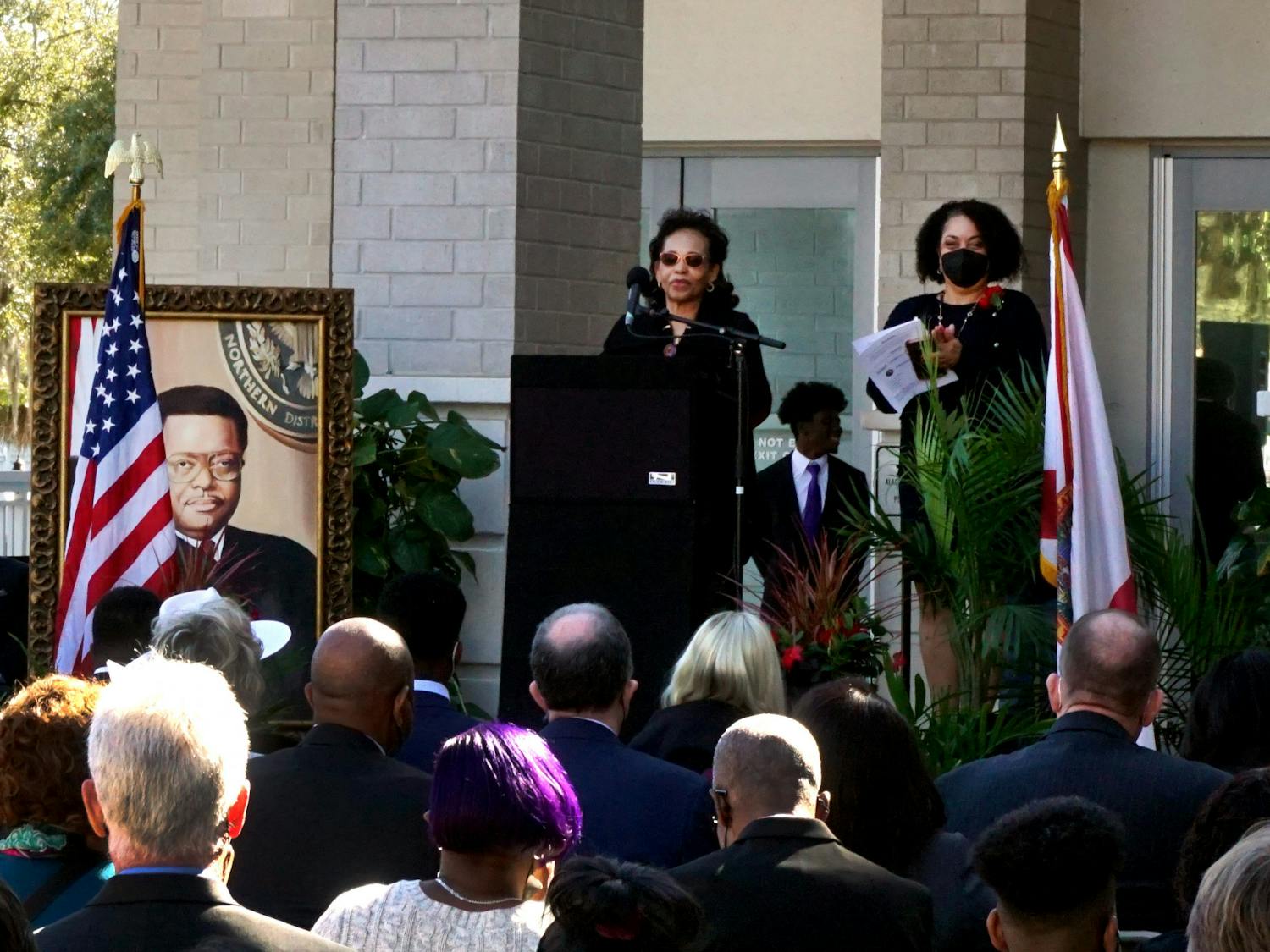 Judge Stephan Mickle's wife, Evelyn Mickle, speaks at the podium about her husband's trailblazing legacy at the renaming ceremony of the Alachua County Courthouse on Friday, Jan. 14. The courthouse is located at 220 S. Main St. 