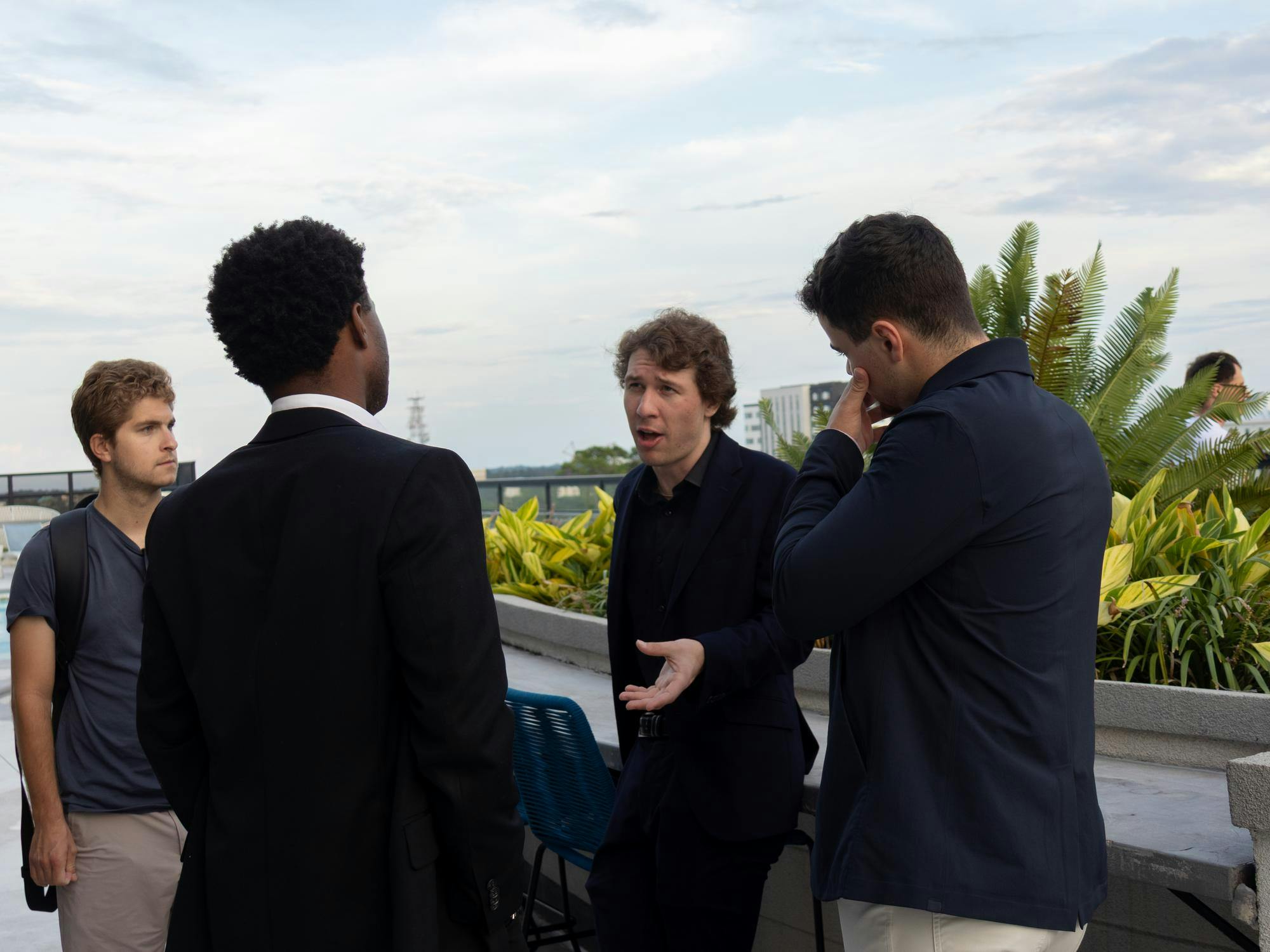 President of UF College Republicans Michael Andre speaks to members Ronald Patterson (left) and Davis Dunphy (right) at their first general body meeting after being disbanded by the university at Hub on 3rd’s rooftop lounge, Tuesday, Sept. 15, 2026 in Gainesville, Fla.