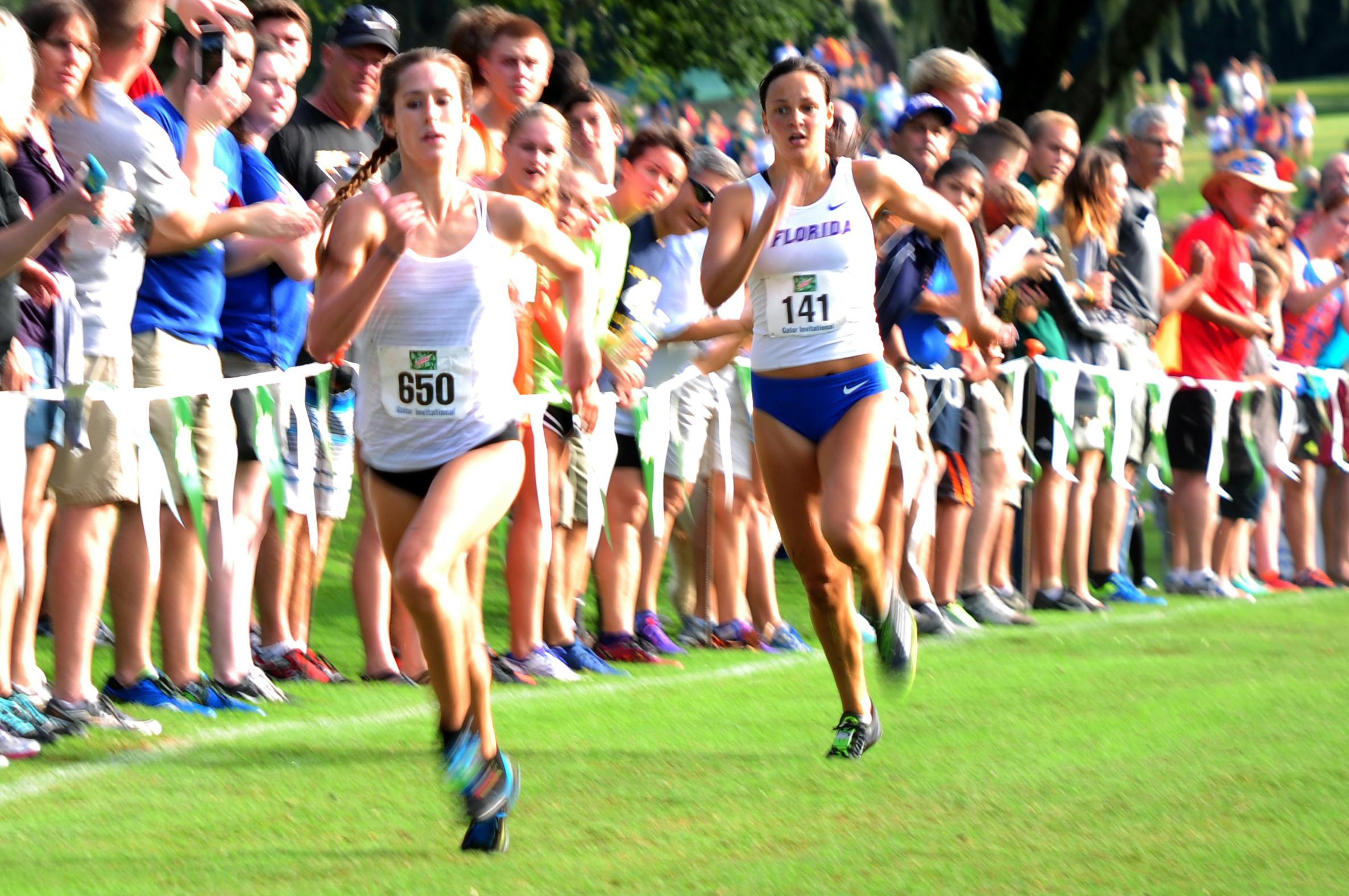 UF's Becky Greene (right) races to the finish during the Mountain Dew Invitational on Sept. 19, 2015, at the Mark Bostick Golf Course.
