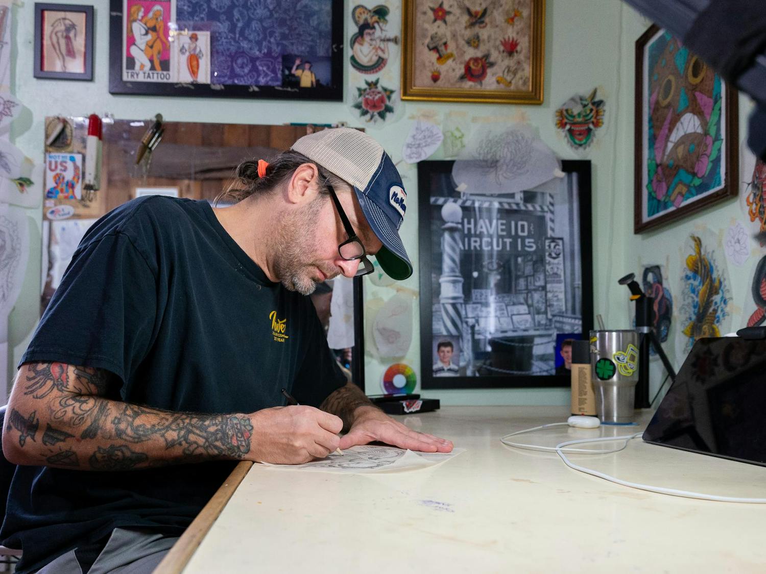 Tattoo artist Mike Salay sketches a new design on Wednesday, Sept. 11, 2024.