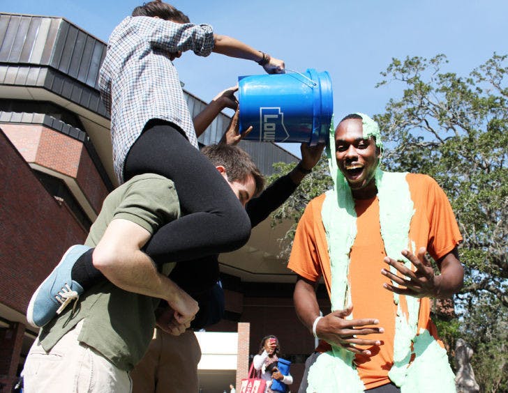 UF mechanical engineering student Nagid Brown, 23, gets slimed to promote a sketch comedy show put on by Theatre Strike Force. The ’90s-themed show took place Thursday evening in the Rion Ballroom.