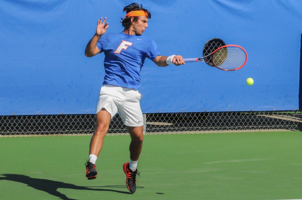 <p>Diego Hidalgo returns a serve during Florida's 6-1 win over Troy on Jan. 17, 2016, at the Ring Tennis Complex.</p>