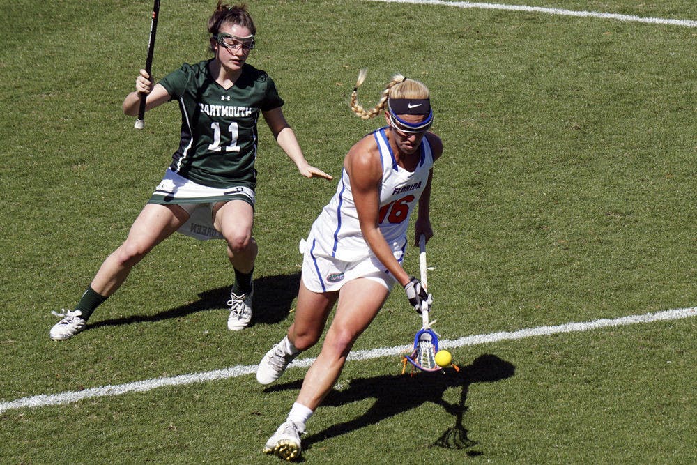 UF's Nicole Graziano (right) makes a play on the ball during Florida's 16-6 win over Dartmouth on Feb. 27, 2016.&nbsp;