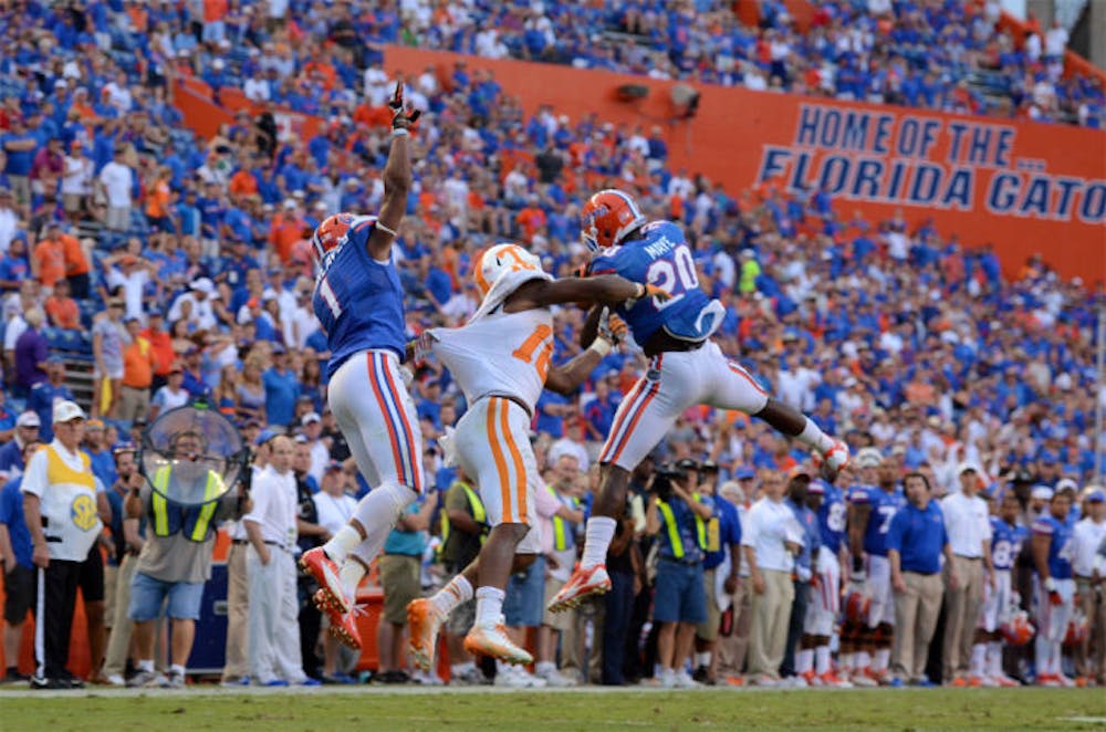 <p><span>Safety Marcus Maye intercepts a pass during Florida's 31-17 win against Tennessee on Sept. 21, 2013 in Ben Hill Griffin Stadium.&nbsp;</span></p>