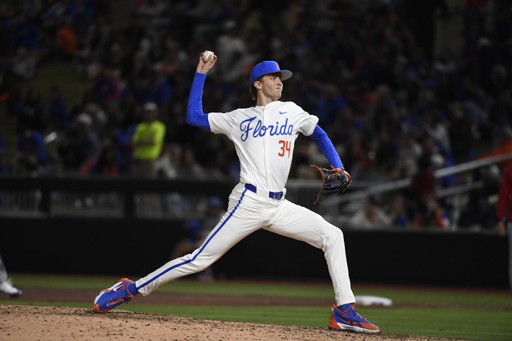 Florida baseball pitcher Alex Philpott pitches the ball in the team's opening night loss to St. John's on Friday, February 16, 2024. 