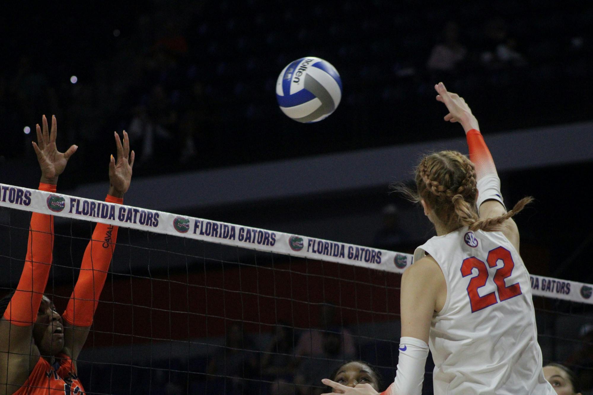 Outside hitter Marina Markova rises above the net during a match with Virginia Aug. 27, 2021.