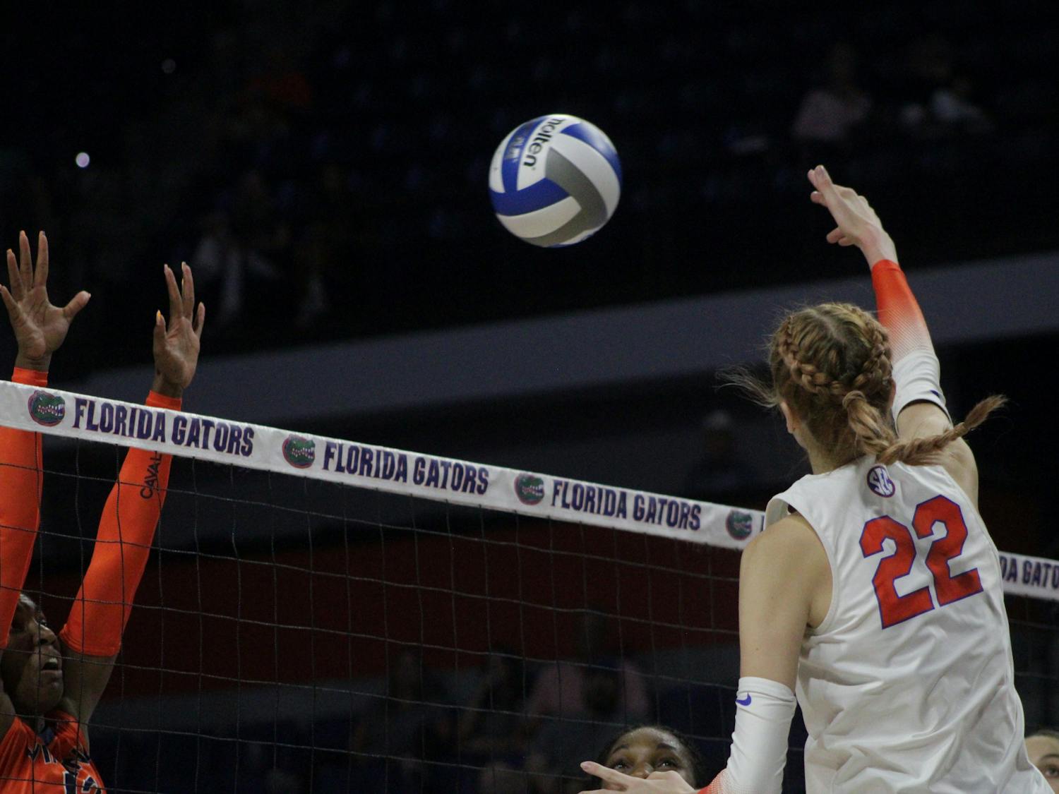 Outside hitter Marina Markova rises above the net during a match with Virginia Aug. 27, 2021.