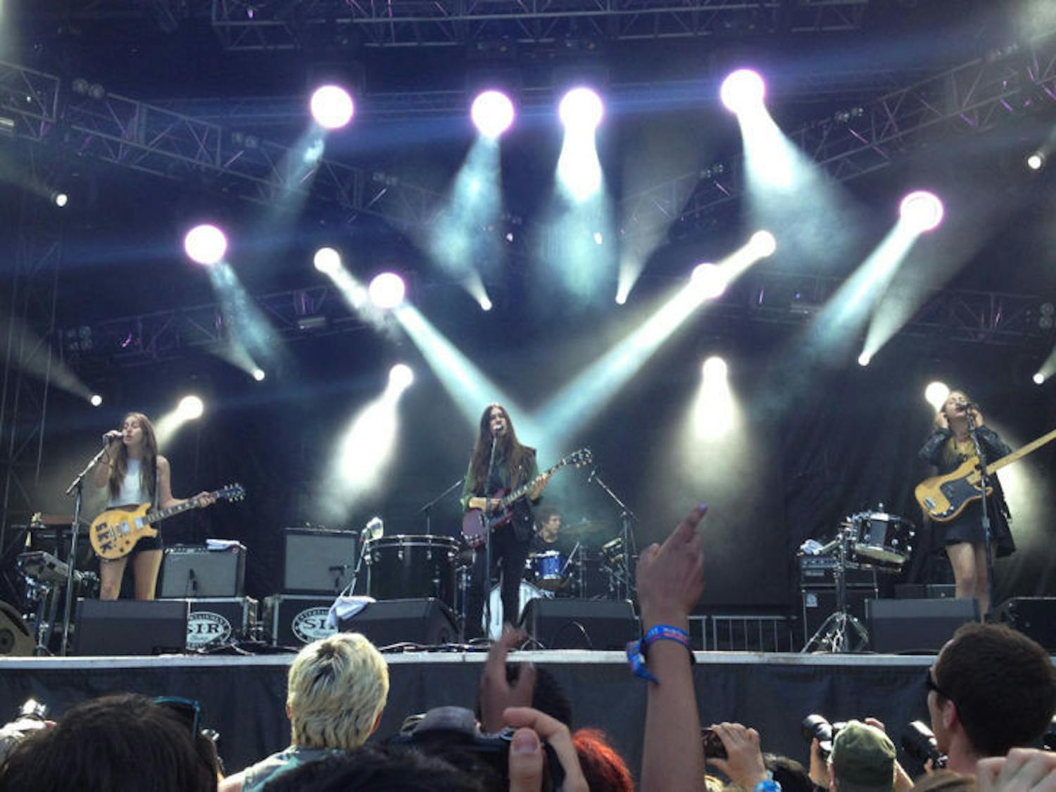 Alana Haim (left), Danielle Haim (center) and Este Haim (right) of HAIM perform at Lollapalooza in August in Chicago’s Grant Park to promote their new album “Days are Gone,” which was released Sept. 30.