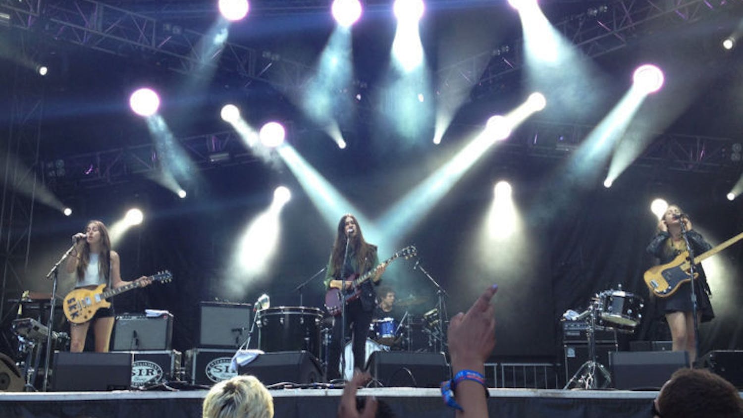 Alana Haim (left), Danielle Haim (center) and Este Haim (right) of HAIM perform at Lollapalooza in August in Chicago’s Grant Park to promote their new album “Days are Gone,” which was released Sept. 30.