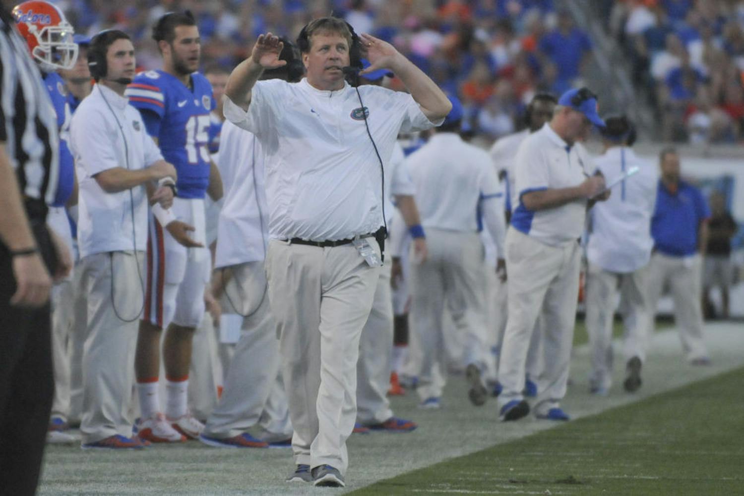 UF football coach Jim McElwain walks down the sideline during Florida's 27-3 win against Georgia on Oct. 31, 2015, at EverBank Field in Jacksonville.