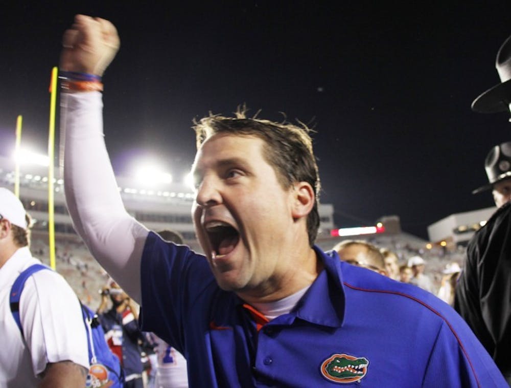 <p><span>Florida coach Will Muschamp celebrates after defeating FSU 37-26 on Saturday at Doak Campbell Stadium in Tallahassee. The Gators won 11 regular-season games for the fifth time in school history.</span></p>
<div><span><br /></span></div>