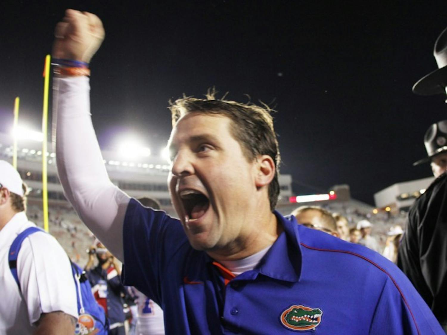 Florida coach Will Muschamp celebrates after defeating FSU 37-26 on Saturday at Doak Campbell Stadium in Tallahassee. The Gators won 11 regular-season games for the fifth time in school history.