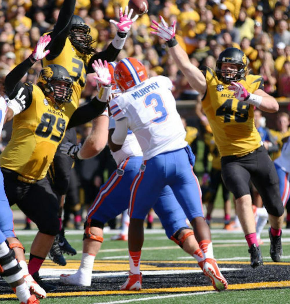 <p>Tyler Murphy (3) attempts a pass during Florida’s 36-17 loss against Missouri on Saturday at Faurot Field in Columbia, Mo. Missouri sacked Murphy six times.</p>