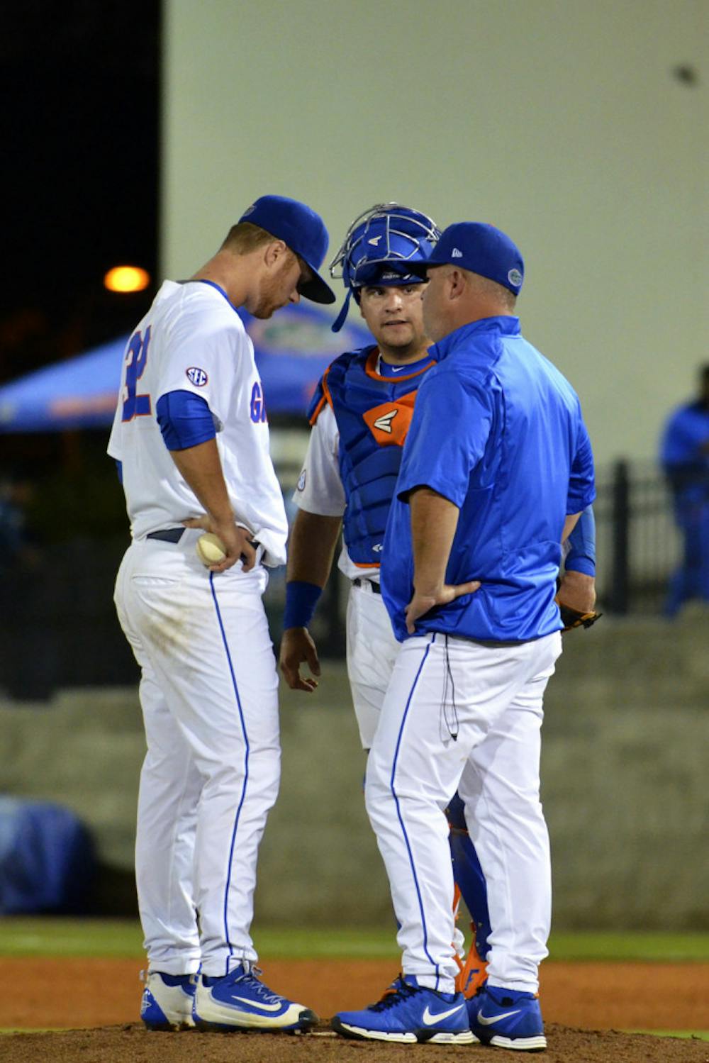 <p>Kevin O'Sullivan (right) visits the mound during Florida's 4-3 win over Missouri on March 18, 2016, at McKethan Stadium.</p>