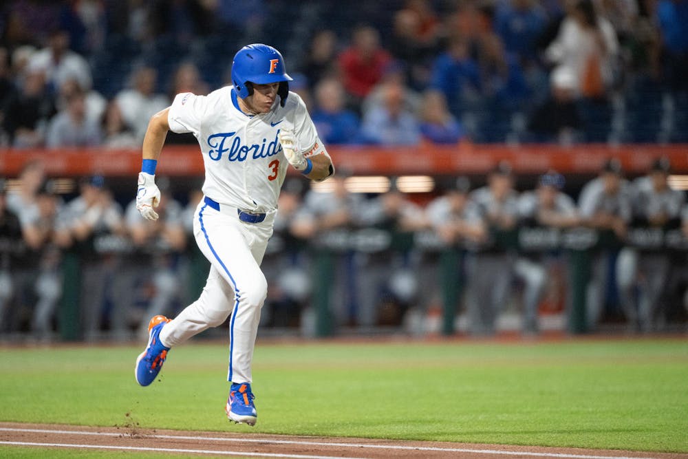 Florida Gators outfielder Kyle Jones (3) sprints to first base in a baseball game against the Air Force Academy in Gainesville, Fla., on Friday, Feb. 14, 2025.