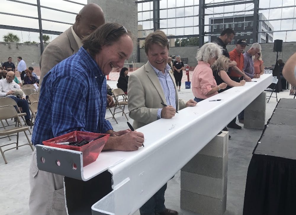 <p>People taking part in the ceremony to celebrate the completion of building a new sports center in Celebration Pointe on Friday, May 6, 2022.</p>