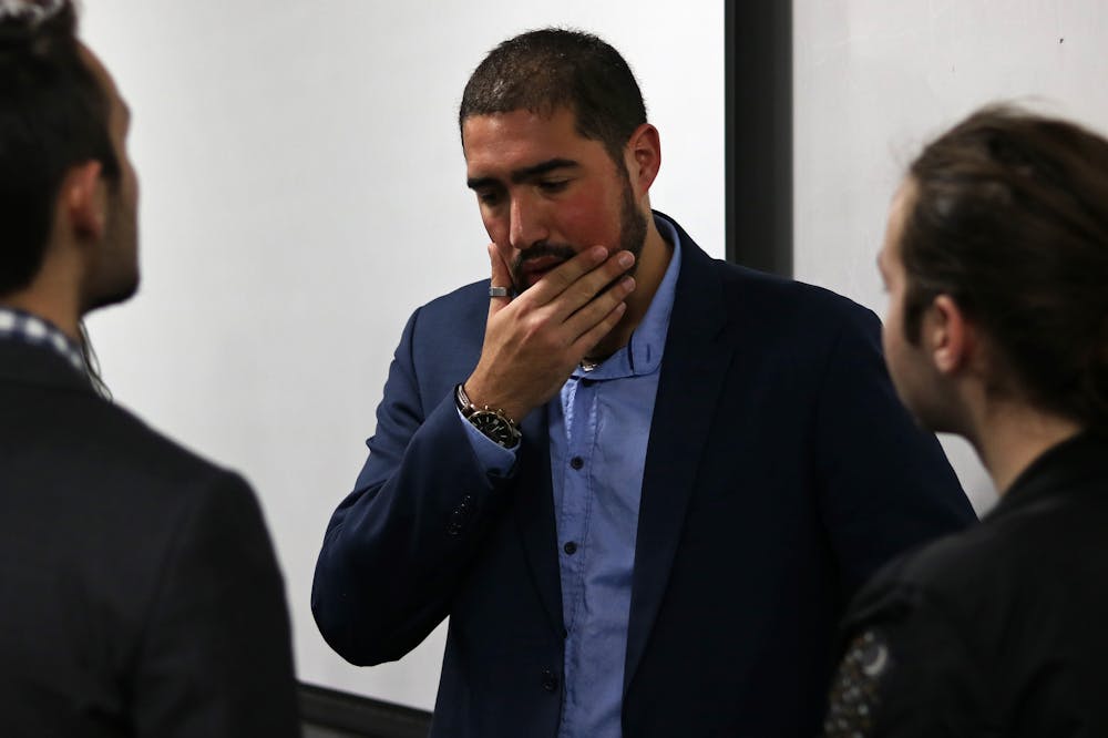 <p dir="ltr">Yoni Michanie, activist and Sgt. 1st Class in the Israeli Defense Force, talks with students Tuesday night after speaking in Little Hall.</p>