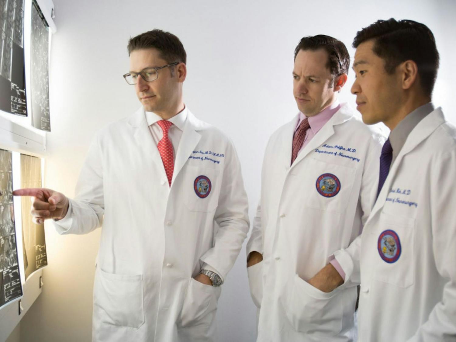 (From left) UF Health neurosurgeons Dr. William Fox, Dr. Adam Polifka and Dr. Daniel Hoh are part of a multidisciplinary team improving care for patients with back and neck pain at the UF Health Comprehensive Spine Center.
