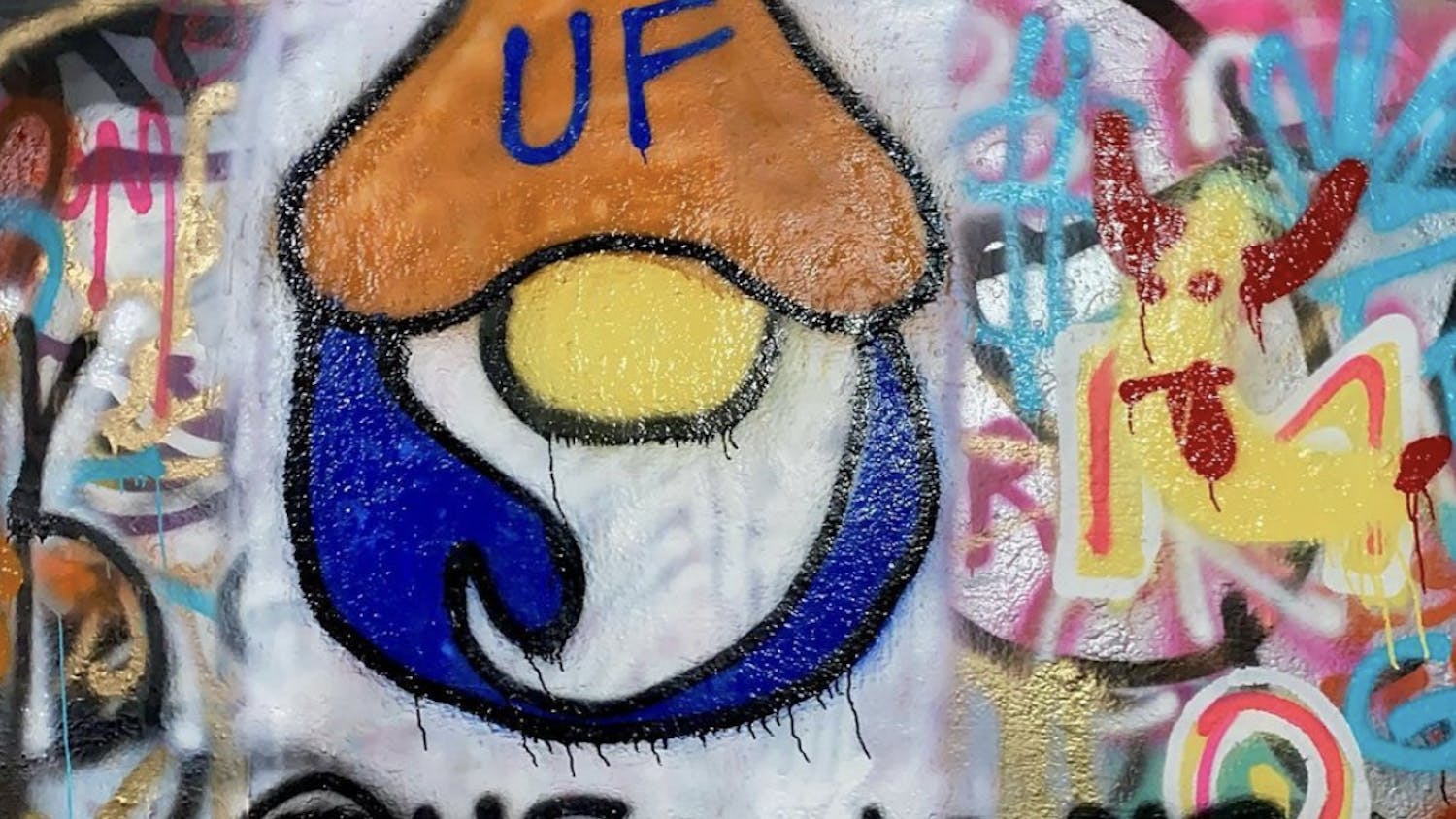 Graffiti of the UF gnome painted in August inside the tunnel near Norman Hall.