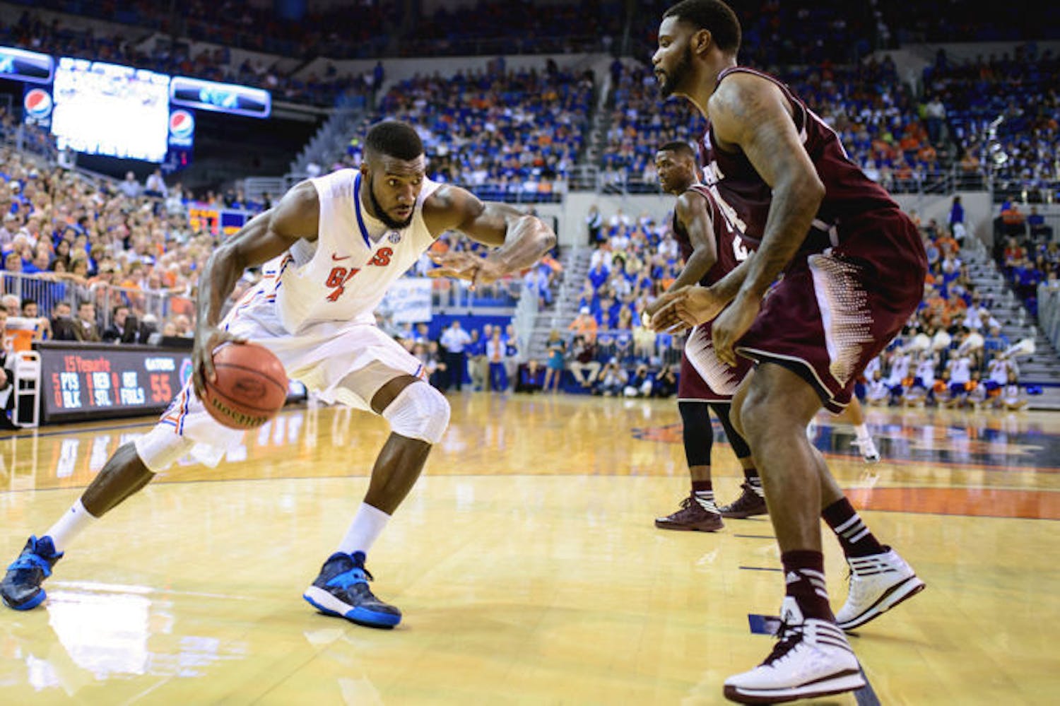 Patric Young drives into the paint against Texas A&amp;M on Saturday. Young’s career-high 14 rebounds helped Florida win its 13th straight Southeastern Conference home game. Young fell short of a double-double, notching nine points against the Aggies.