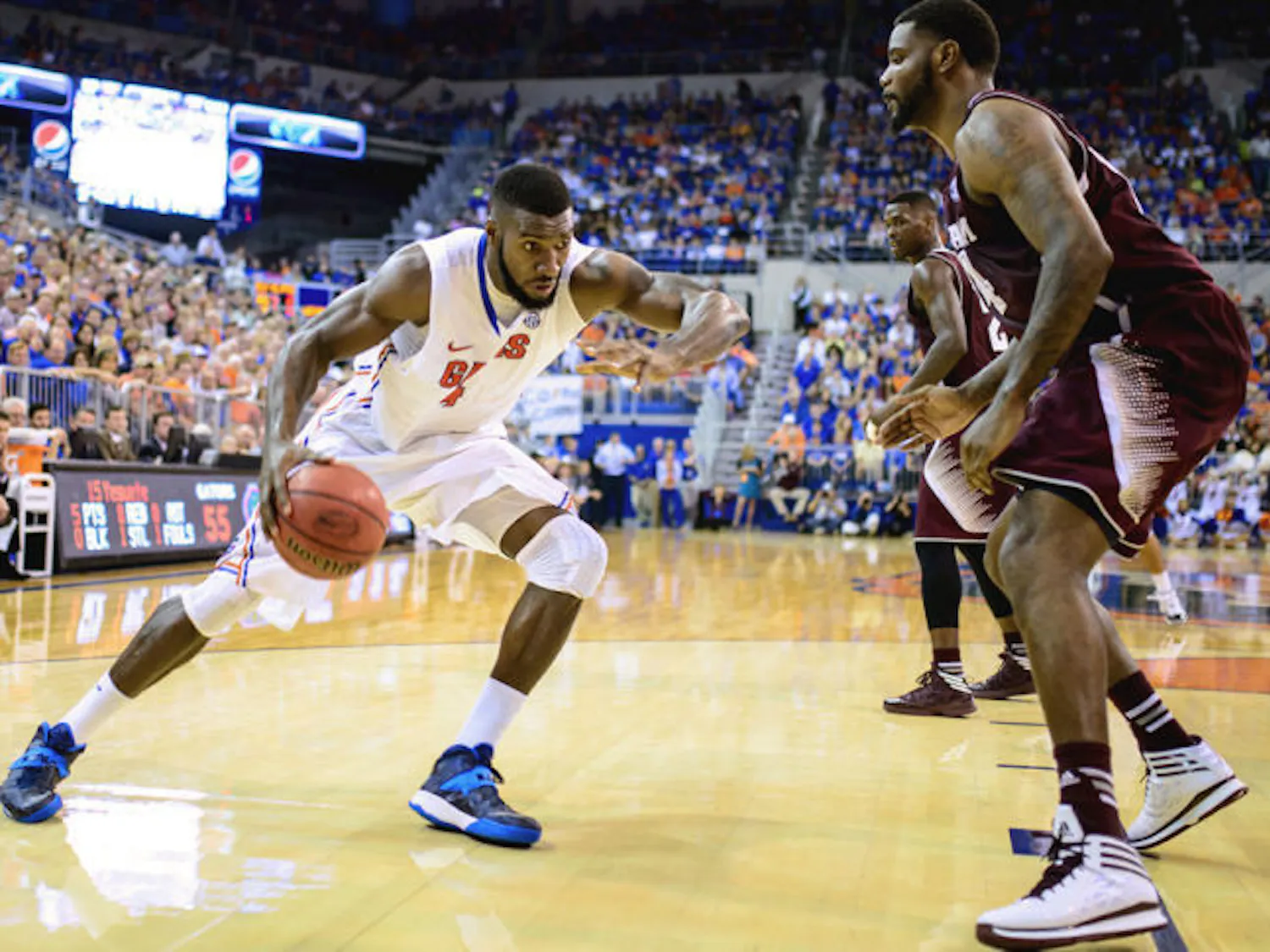Patric Young drives into the paint against Texas A&M on Saturday. Young’s career-high 14 rebounds helped Florida win its 13th straight Southeastern Conference home game. Young fell short of a double-double, notching nine points against the Aggies.