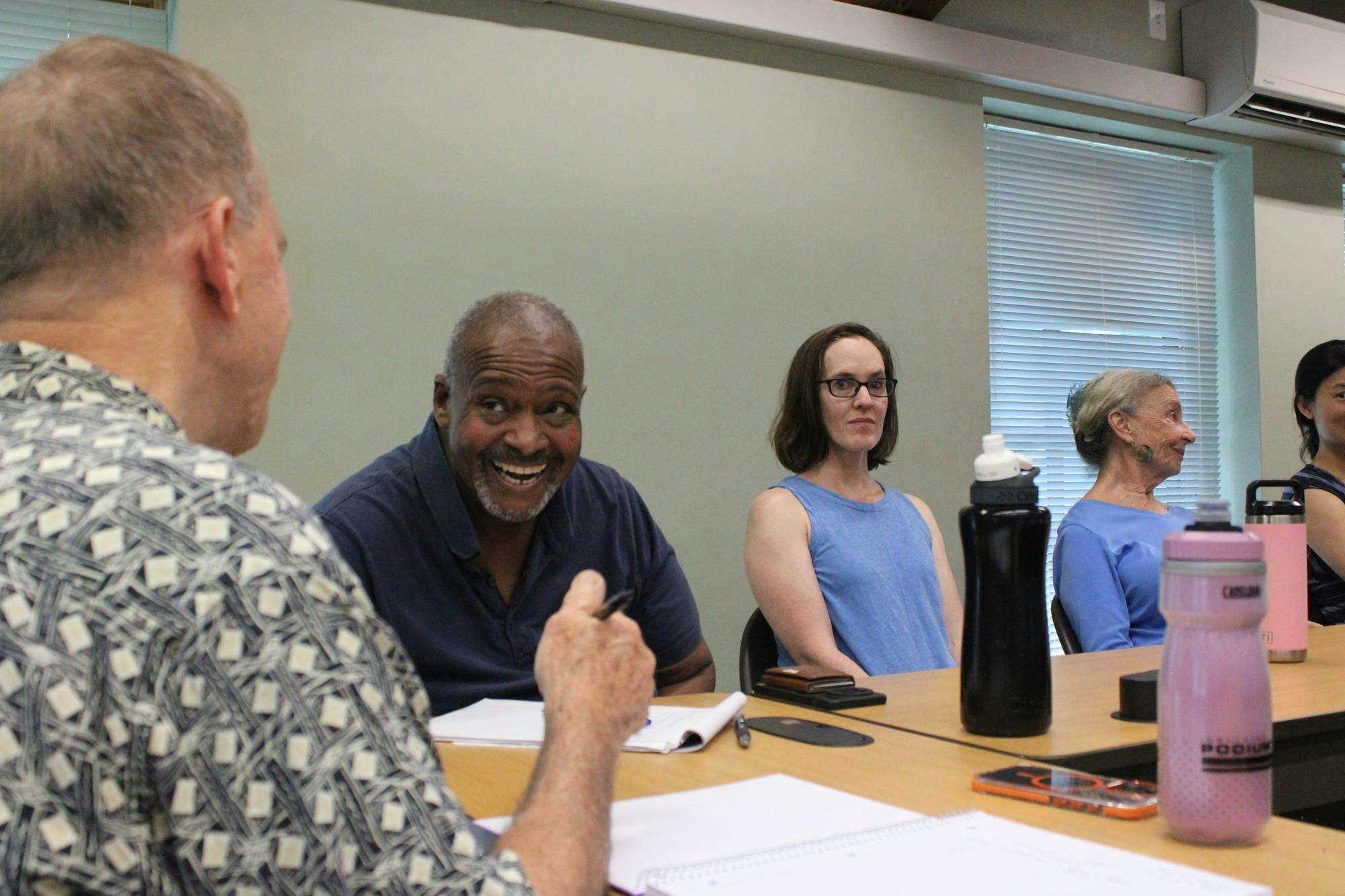 Gainesville residents gather to practice Spanish by conversing, reviewing vocabulary, and reading a short passage about the latest film adaption of The Odyssey, Friday, July 24, 2026.