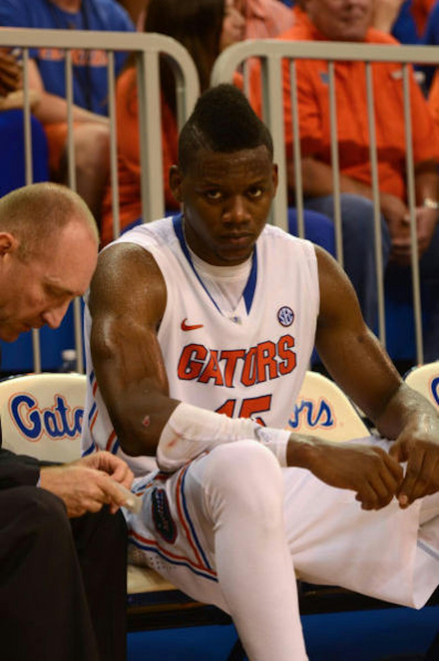Senior forward Will Yeguete sits on the bench during No. 19 Florida's 67-61 win against No. 13 Kansas on Tuesday night in the O'Connell Center.