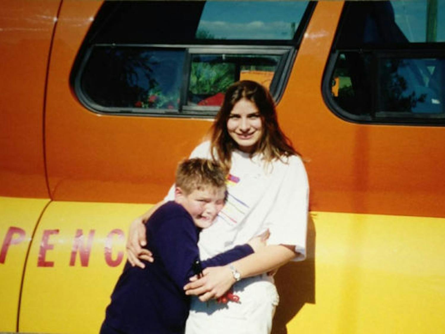 Silvana and Spencer Smud stand in front of the Oscar Mayer Wienermobile after Silvana got the job of driving it across the country when she graduated in 1999. Spencer, now 23, will drive the car in June.