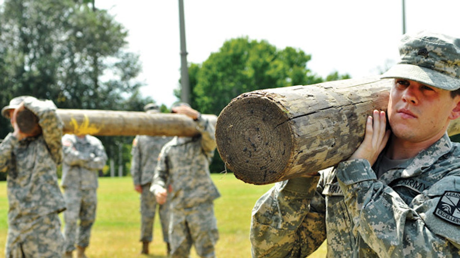 Cadet Sgt. Ben Mathews, a family, youth and community sciences major, lifts a log in a drill&nbsp; to prepare for Ranger Challenge.