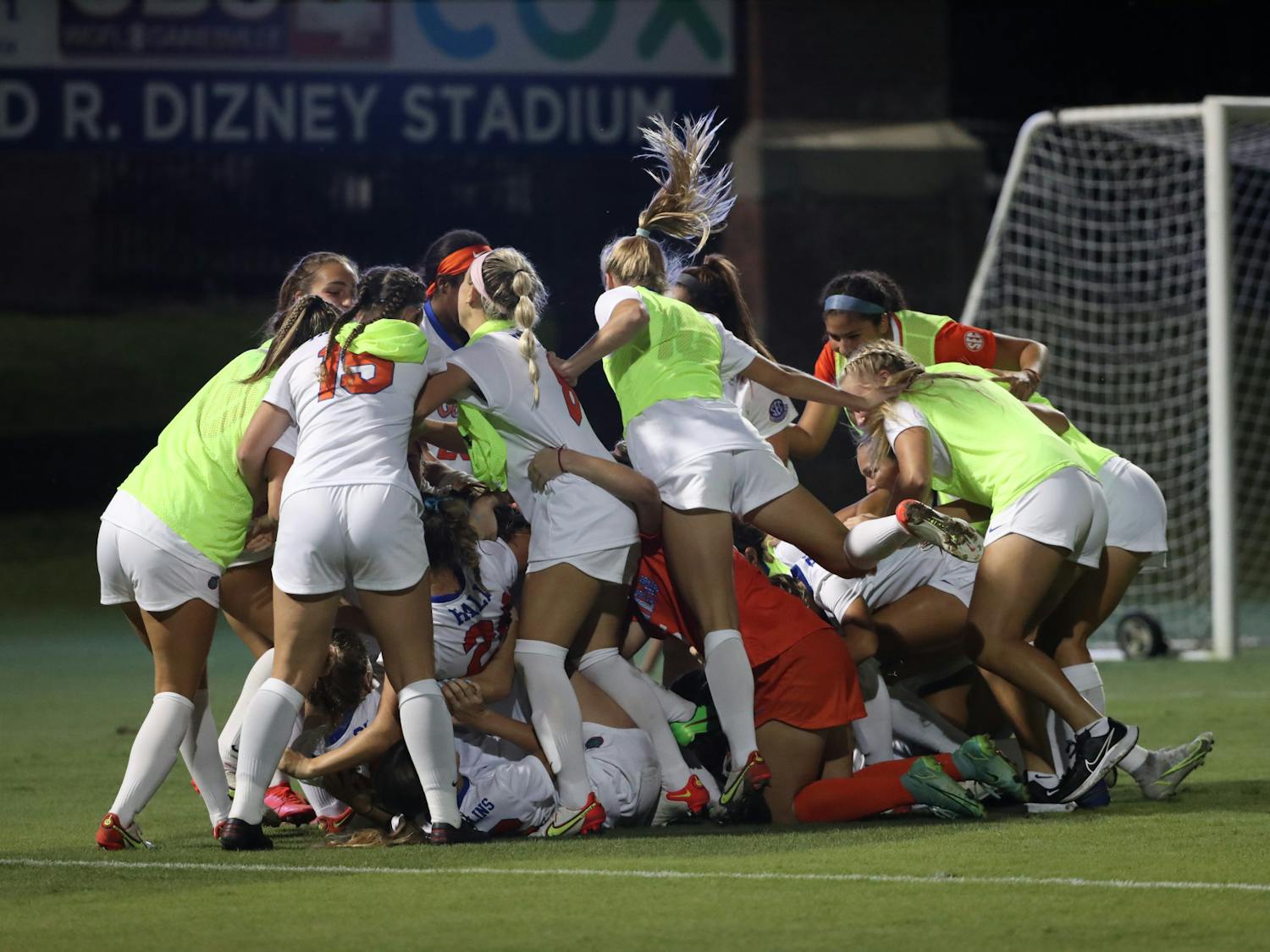 Florida soccer jumps on Julianne Leskauskas in celebration of its win over Kentucky Sept. 23, 2021. The Gators announced the hiring of new head coach Samantha Bohon Monday.