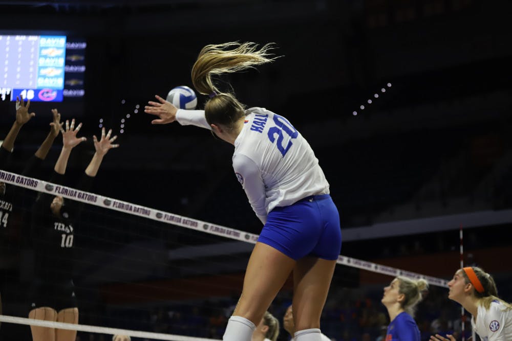 Thayer Hall spikes the ball at Florida's game against Kentucky last season. On Friday night, Hall recorded 19 kills in the Gators' victory over Alabama.
