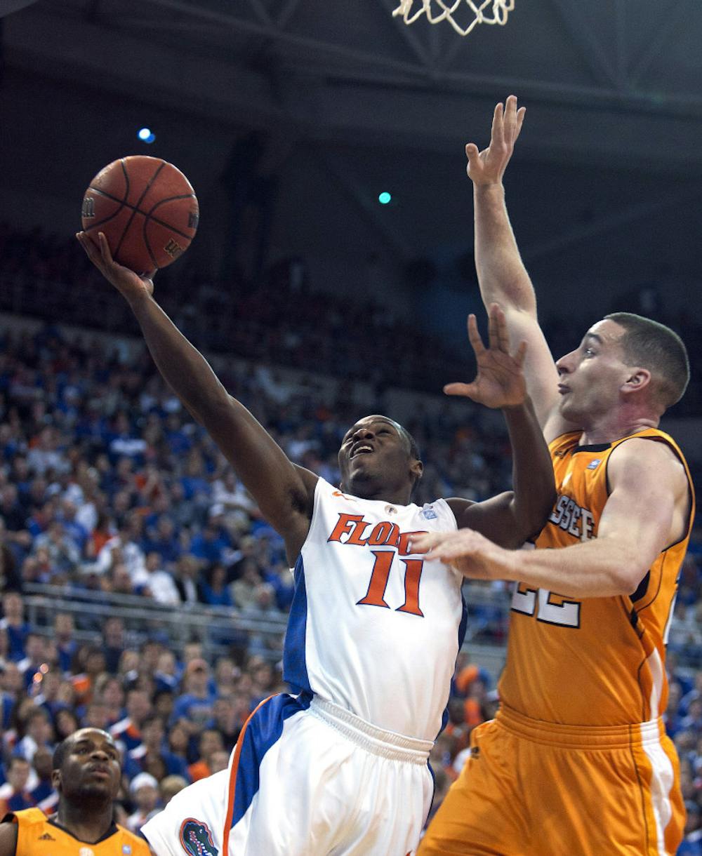 Florida guard Erving Walker goes to the hoop against Tennessee’s Steven Pearl in UF’s 61-60 win Saturday in the O’Connell Center.