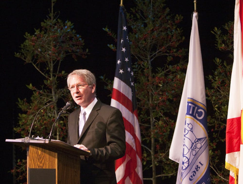 <p>Gainesville Mayor Craig Lowe speaks from a lectern to residents and city officials at the Hippodrome State Theatre during the annual State of the City address Wednesday.</p>