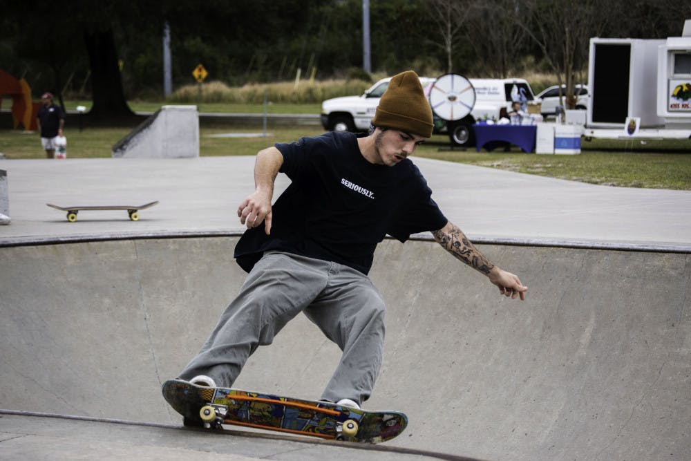 <p>Sly Sullivan, a 22-year-old local skater, practices for the Possum Creek Skate Park Jam on Saturday.</p>