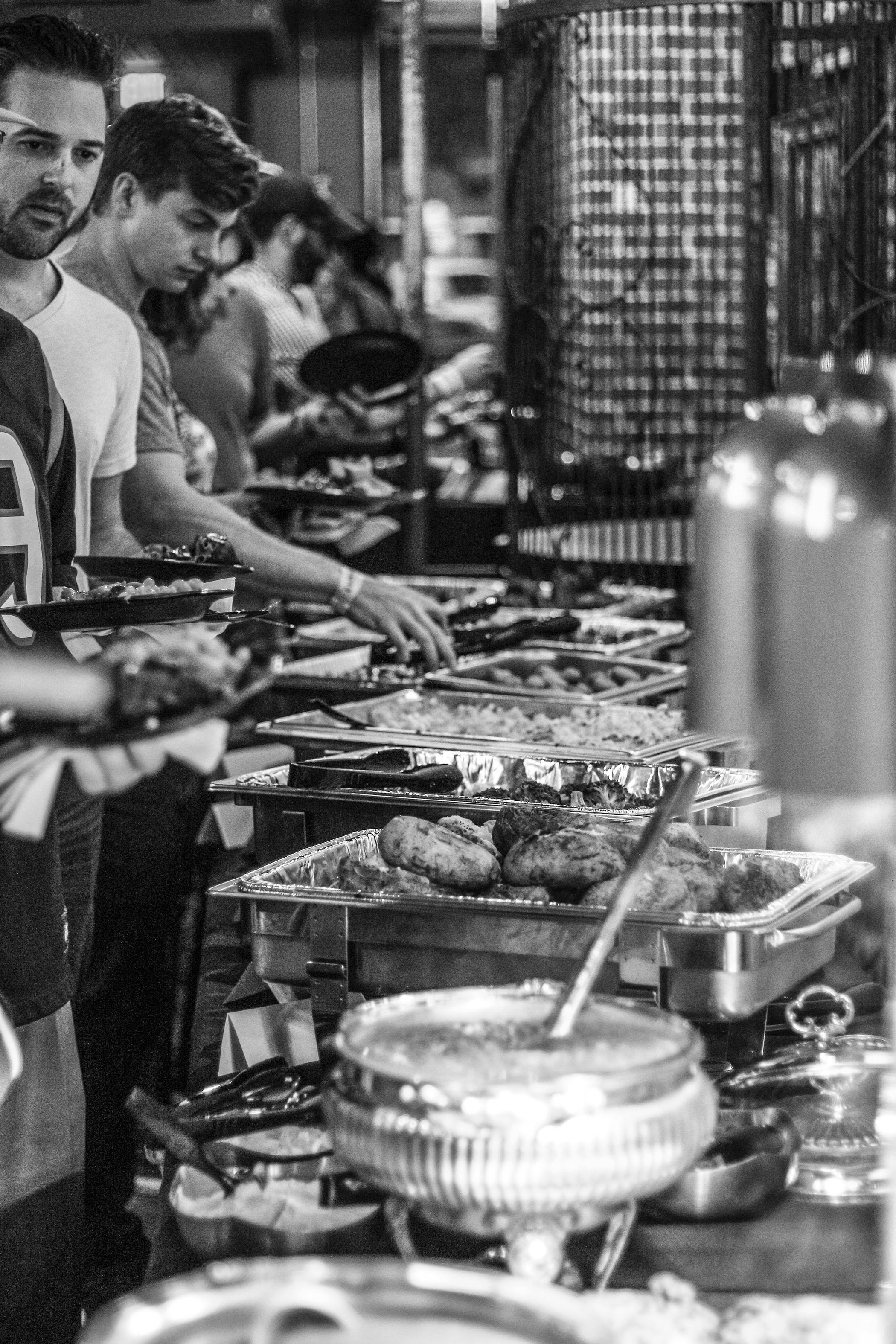About a dozen people wait in line for The Social at Midtown's Super Bowl Party and All You Can Eat Buffet. The buffet included macaroni and cheese, filet mignon, hors d'oeuvres and much more.