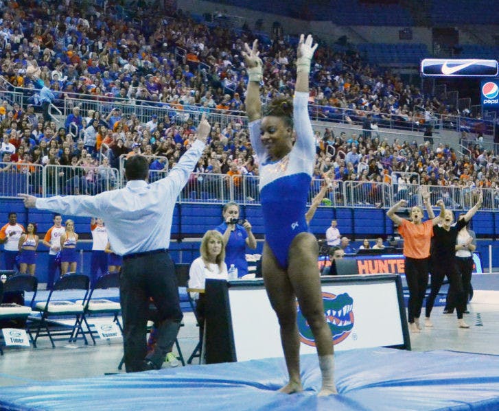 Kytra Hunter performs a vault routine during Florida’s 197.525-196.025 win against Arkansas on Feb. 14 in the O’Connell Center.