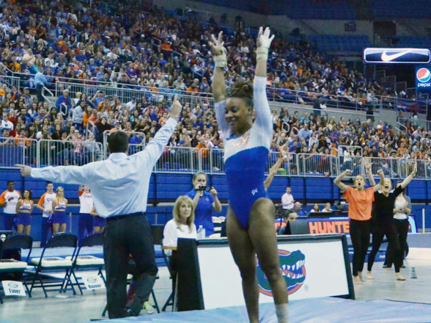 Kytra Hunter performs a vault routine during Florida’s 197.525-196.025 win against Arkansas on Feb. 14 in the O’Connell Center.