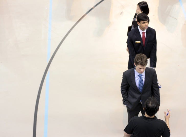 Students wait in line to talk to a representative from Ryder Logistics and Transportation Solutions Worldwide at the Career Showcase in the O'Connell Center on Tuesday afternoon.