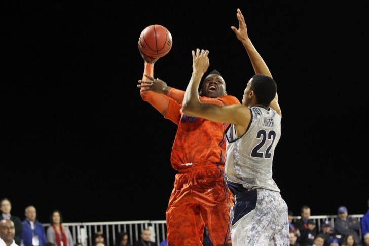 Florida forward Will Yeguete attempts a shot against Georgetown forward Otto Porter (22) aboard the USS Bataan in Jacksonville on Nov. 9.
