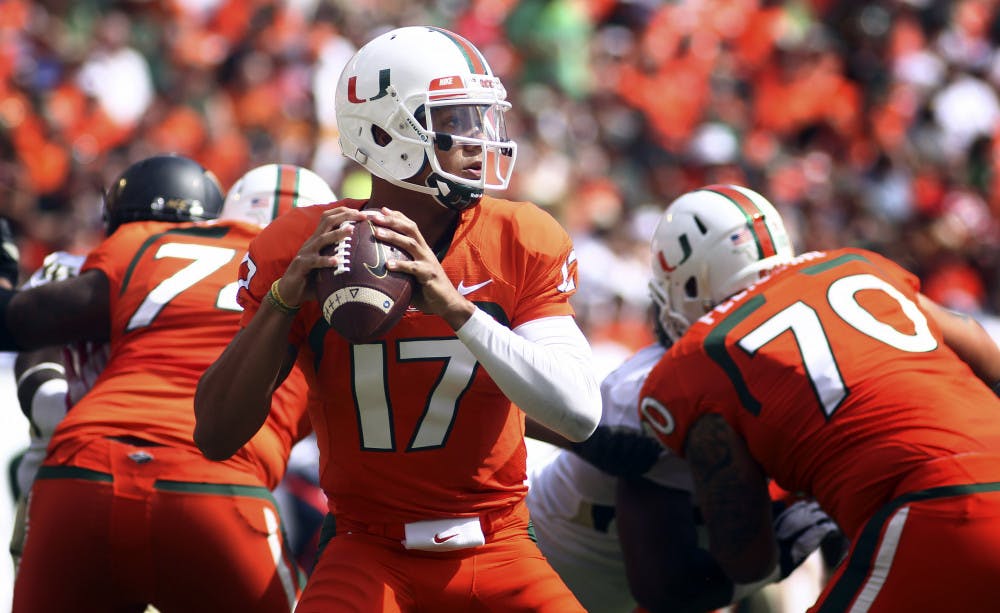 <p>Miami quarterback Stephen Morris (17) passes for a first down during his team's 24-21 win against Wake Forest in Miami Gardens on Oct. 26.</p>