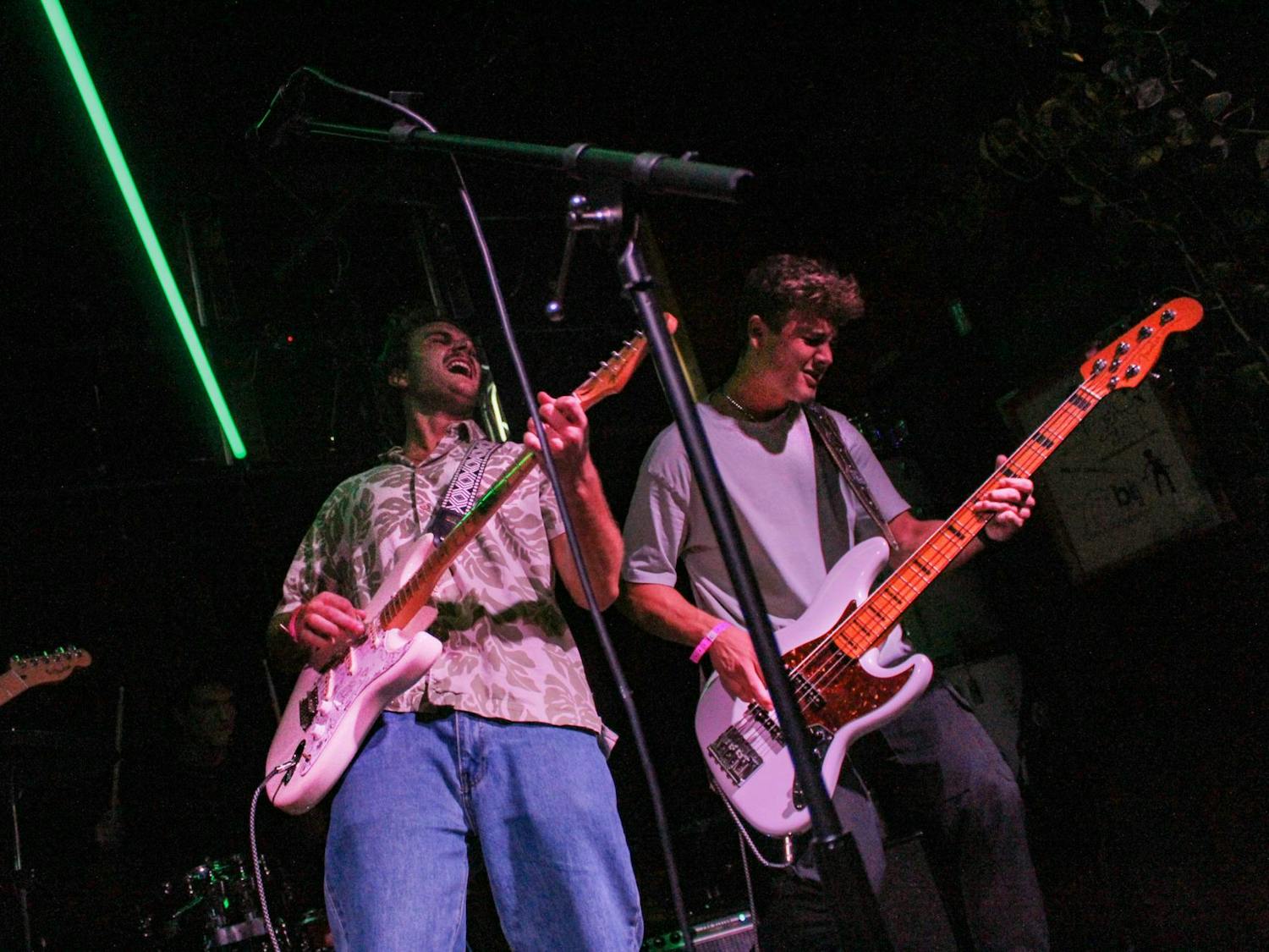 Evan Fleischer (left) and Kai Beres (right) play the “Use Your Voice: Battles of the Bands” show at How Bazar in Gainesville, Fla., Thursday, Oct. 2, 2025.
