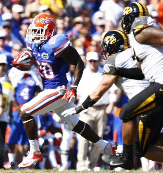 Omarius Hines runs by two Missouri defenders en route to a 36-yard touchdown in UF’s 14-7 win on Saturday in The Swamp.

