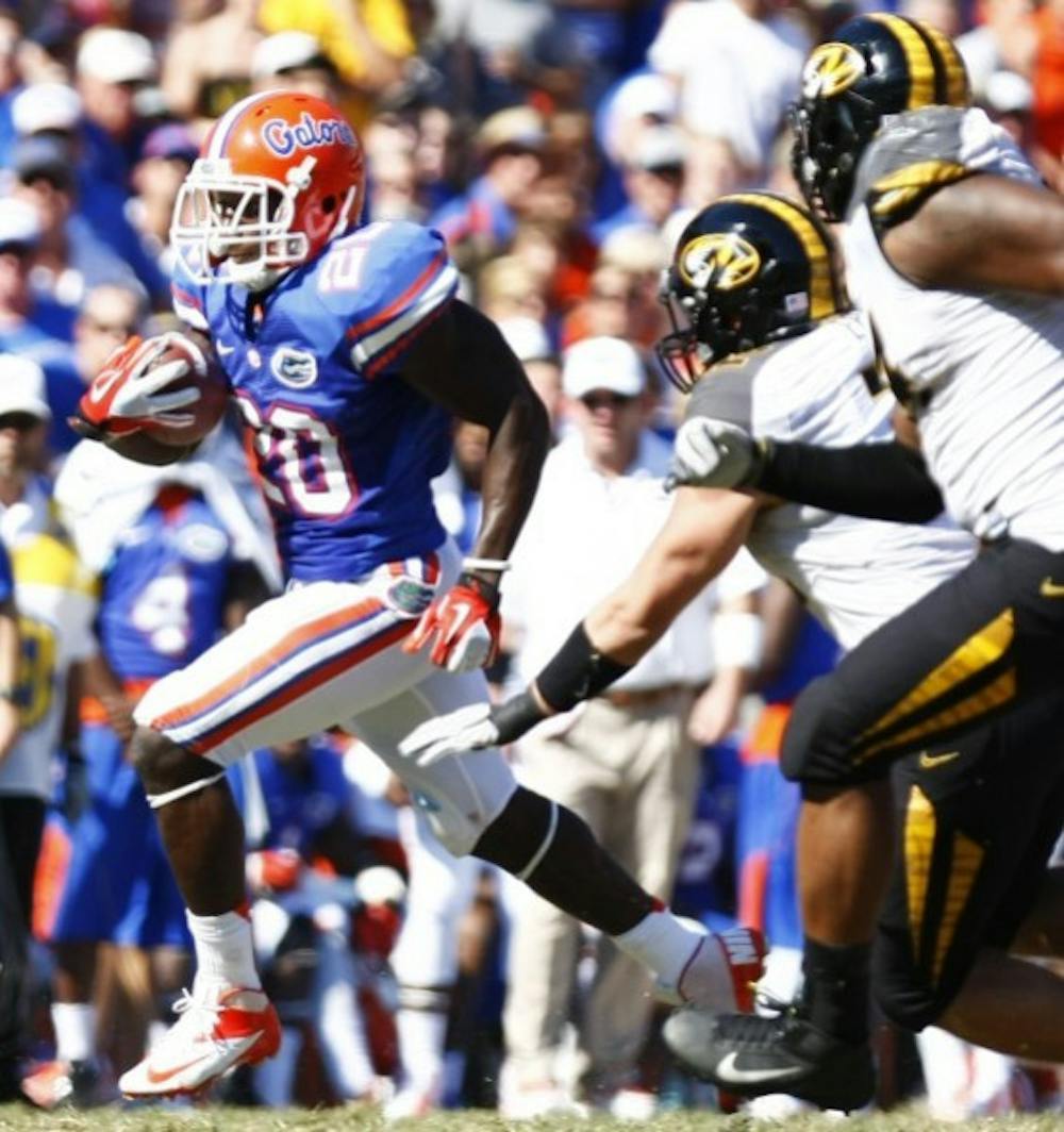 <p><span>Omarius Hines runs by two Missouri defenders en route to a 36-yard touchdown in UF’s 14-7 win on Saturday in The Swamp.</span></p>
<div><span><br /></span></div>