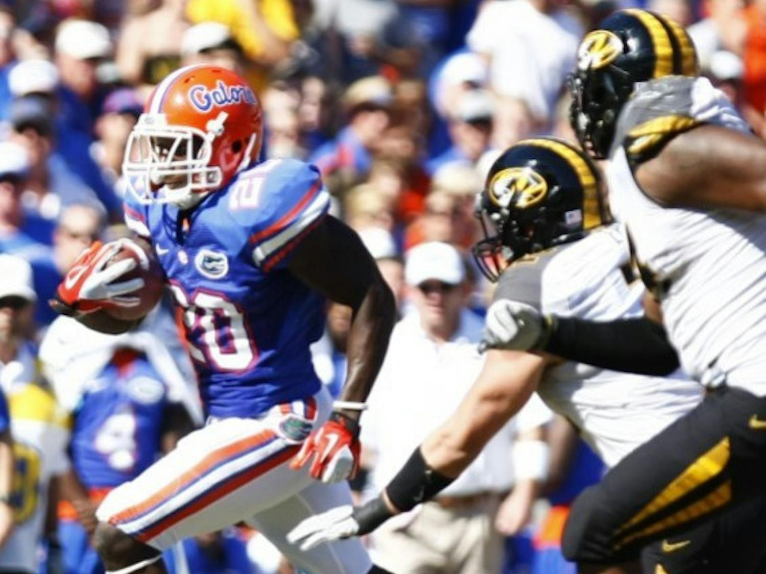 Omarius Hines runs by two Missouri defenders en route to a 36-yard touchdown in UF’s 14-7 win on Saturday in The Swamp.
