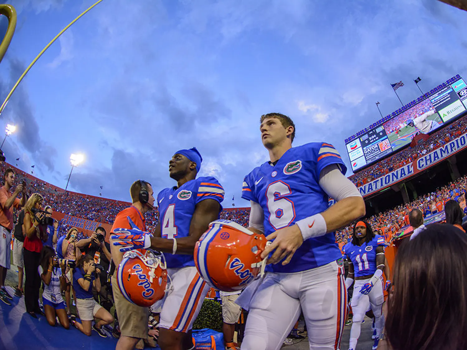 Game capatins Andre Debose (4), Jeff Driskel (6) and Neiron Ball (11) walk out the players tunnel prior to kickoff between UF and UK on Sept. 15, 2014 evening in Ben Hill Griffin Stadium.