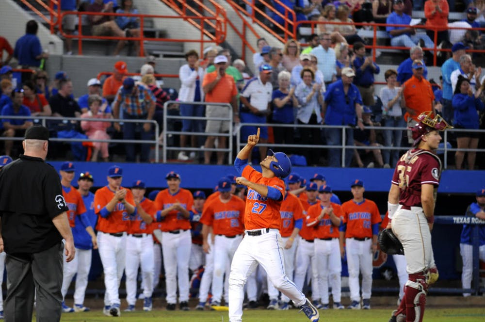 <p>Nelson Maldonado celebrates after hitting a home run during the second inning of Florida's 6-0 win over FSU on Tuesday night.</p>