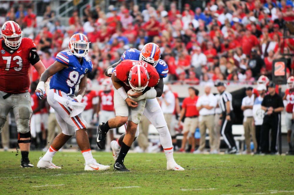 Bryan Cox tackles Georgia quarterback Jacob Eason during Florida's 24-10 win over UGA on Oct. 29, 2016, in Jacksonville.